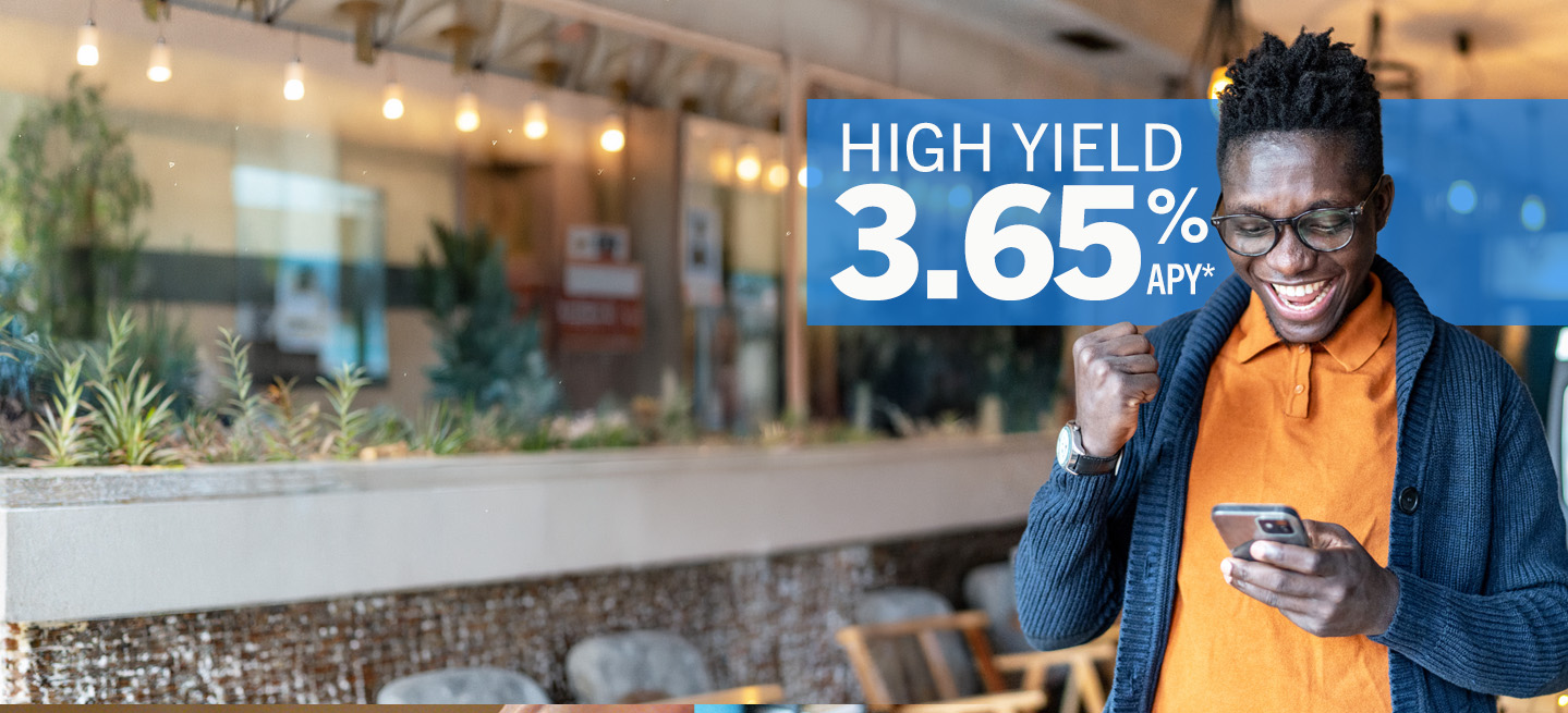 High Yield Savings Hero Banner man excited about the great rate while looking at his phone