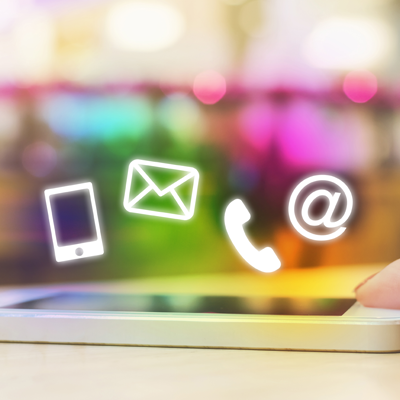 Colorful animated icon of a mobile phone, email, handheld phone, and the @ symbol