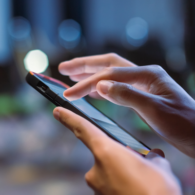 Person scrolling on their mobile phone