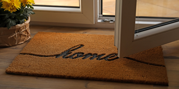 A welcome home doormat at a newly purchased home using a mortgage from St Mary's Bank.