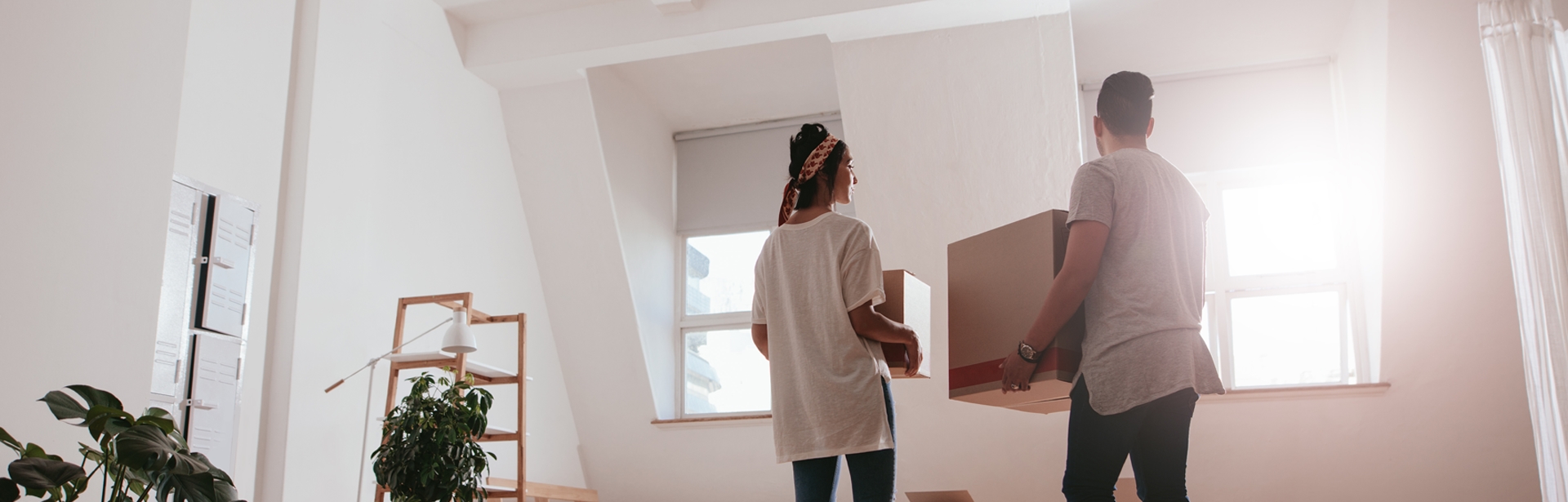 Mortgage banner young couple moving into home
