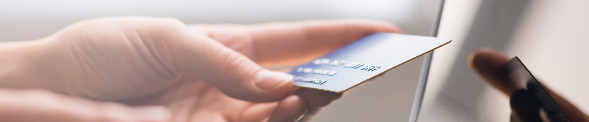Someone holding a credit card